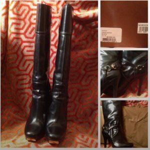 Gucci... Black leather high-heel knee high boots